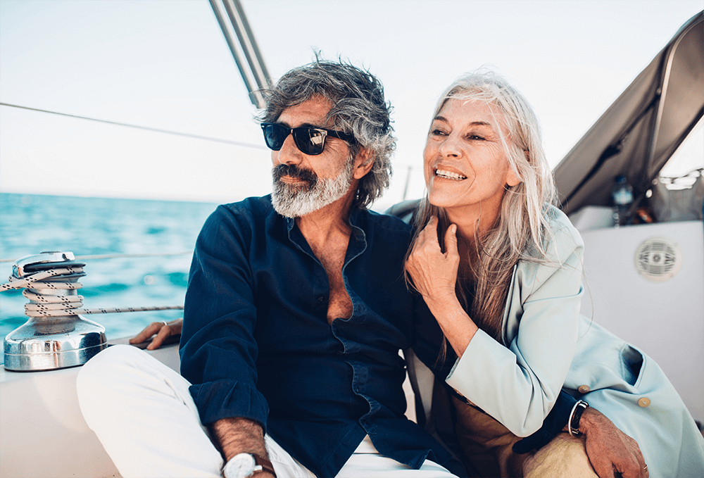 Senior couple sitting on yacht deck